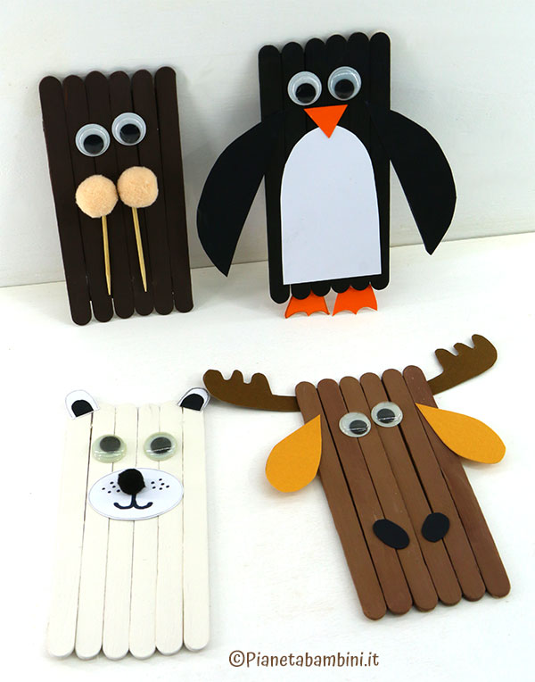 Pinguino, alce, tricheco e orso polare con bastoncini da gelato Animali artici con bastoncini da gelato